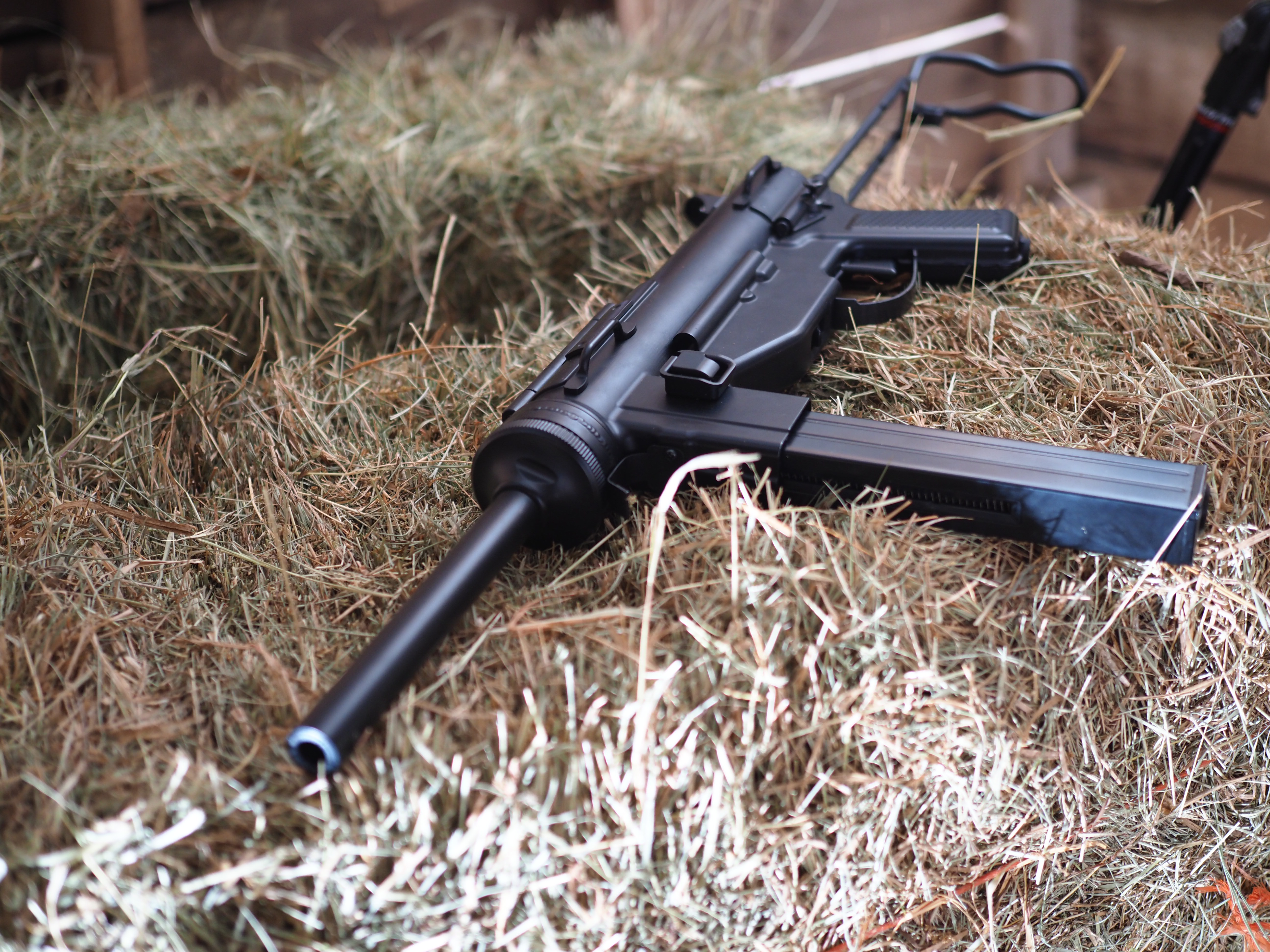 Legends M3 Grease gun staged on a hay bale